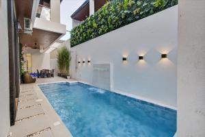 a swimming pool in the middle of a house at Luxury House with Private Pool for Gathering in Davao City