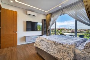 a bedroom with a bed and a large window at Luxury House with Private Pool for Gathering in Davao City +82 photos