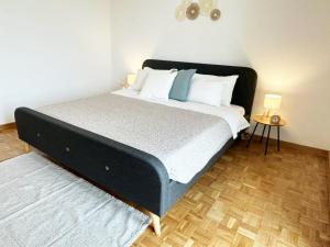 a bedroom with a large bed with white pillows at Quick Home Belvedere Masserano in Masserano