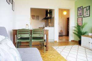 a kitchen and dining room with a table and chairs at Quick Home Belvedere Masserano in Masserano