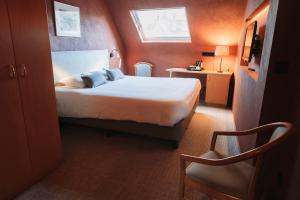 Llit o llits en una habitació de Albion Hotel