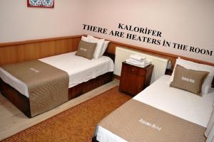 Кровать или кровати в номере Aspawa Hotel