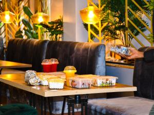 a table with food in plastic containers on it at Decale Jewel Stone Hotel in Nairobi