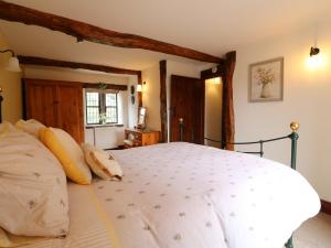 a bedroom with a large white bed in a room at Orchard View in Alfreton