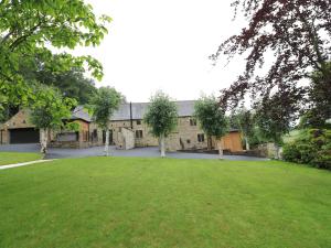 a large building with a large lawn in front of it at Orchard View in Alfreton