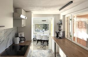 a kitchen with a table and a dining room at Waldhaus zur Kleinbahn in Glashütte