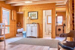 a room with a bathroom with a sink and a washing machine at Chalet Solariale in La Teste-de-Buch +12 photos
