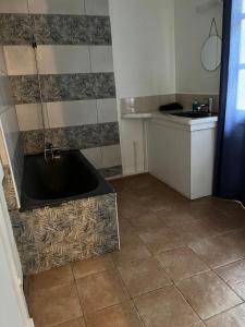 a kitchen with a bath tub in the floor at La Kaz Yab in Salazie +41 photos