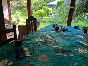 a table with a blue table cloth on it at La Kaz Yab in Salazie