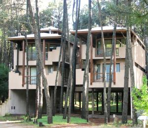 a building with trees in front of it at Chai Thale in Mar de las Pampas