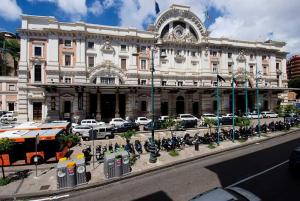 a large building with bikes parked in front of it at Casa Vacanze Sannazzaro Flat in Naples