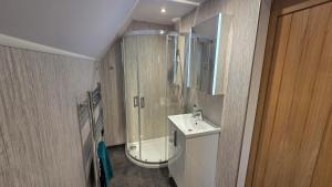 a bathroom with a shower and a sink at Bunroy Park in Fort William +100 photos