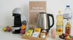 a kitchen counter with a coffee maker and some food at Apartalux Benicassim Premium in Benicàssim
