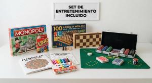 a table with games and books on top of it at Apartalux Benicassim Premium in Benicàssim
