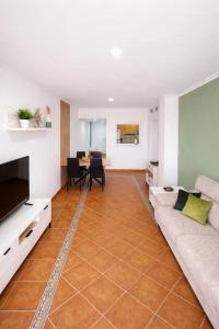 a living room with a couch and a table at Heavenly Homes Mojacar 75 in Mojácar