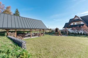 a park with a pavilion and a playground at Wierchy View - bespoke villas in Kościelisko