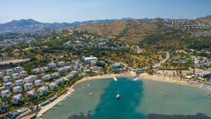 an aerial view of a beach in a resort at Mira Beach Resort Bodrum - All inclusive in Bodrum City