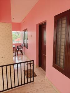 a room with a staircase and a door and a table at Basuri Beach Resort in Varkala