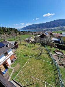 an aerial view of a field with trees and houses at Ferienwohnung Sankt Josef 2 in Bodensdorf