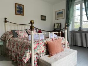 a bedroom with a bed with pillows on it at Chez Lapage in Saint-Avit-Sénieur
