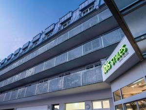 a building with a sign on the side of it at ibis Styles Graz Messe in Graz