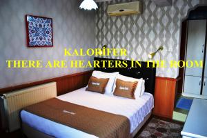Кровать или кровати в номере Aspawa Hotel