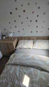 a bedroom with a bed and a ceiling with polka dots at Mountain Paradise Apartment in Zgornje Gorje