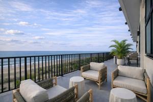 a balcony with a view of the beach at Ashore Oceanfront Hotel by Marriott in Ocean City