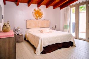 a bedroom with a bed and a mirror on the wall at Villa Chia 2 in Chia