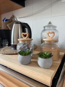 two jars on a cutting board on a kitchen counter at B&B Il Balcone Fiorito in Imola