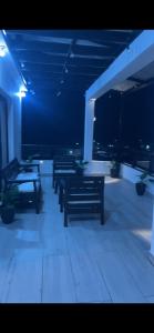 a row of benches in a building at night at RUKA Hotel in Punta Cana