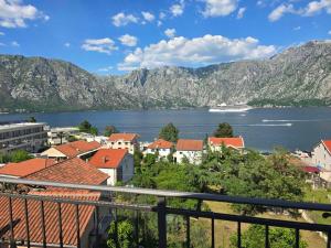 a view of a town and a body of water at Horizon Apartments in Prčanj