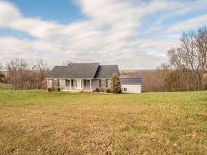 a house on a hill with a field at Haven Hill House - Scenic Getaway near Bardstown & Bourbon Trail in Springfield