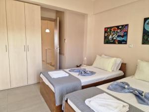 a room with two beds in a room at Lela's House in Yerakiní
