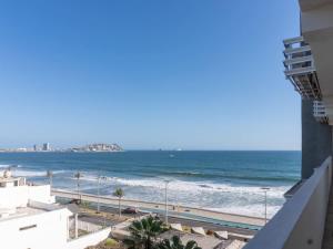 a view of the ocean from a building at On the Malecón with ocean lagoon & pool in Mazatlán