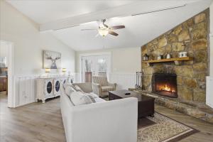 a living room with a couch and a fireplace at Working 9 to Pine by Beyond Expectations with Views in Sevierville