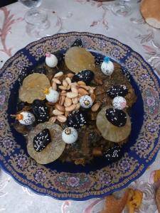 a plate of food on a table with a plate of food at Dar Noor El Chams in Salé