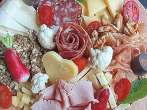 a bunch of different types of food on a plate at Chalet confortable avec terrasse - 6 pers. - API-1-52-2004 in Saint-Oyen