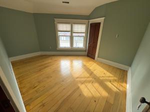 an empty room with a wooden floor and a window at Historic 1908 Wamsley House-Completing Renovation! in Hamilton