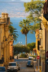 a city street with cars parked on the street at Enne29 in Reggio di Calabria