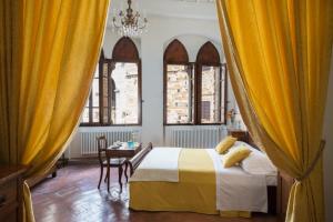 Postel nebo postele na pokoji v ubytování B&B San Gimignano Diffuso