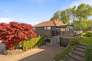 an overhead view of a house with a tree at Lykkebo in Stavanger