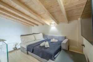 a bedroom with a bed with two hats on it at Kallistis Home in Kontokali