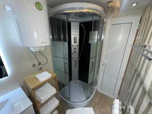 a small bathroom with a shower and a toilet at Motel Era i Sin in Ba°evac +53 photos