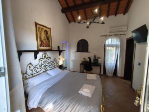 a bedroom with a large bed with a white bedspread at Il Quercetino di Momo in Ravenna
