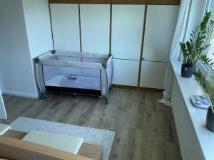 a room with a bed in the corner of a room at FewoConny in Hattstedt