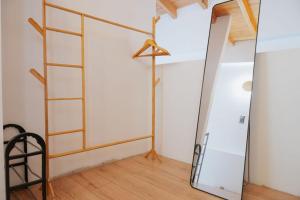 a dressing room with a mirror and a ladder at Nafos Villa Stella in Levkákia +39 photos