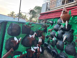 a group of lego figurines on the side of a building at Happy Hills in Yelagiri +10 photos