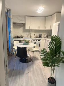 a kitchen with a table and chairs in a kitchen at Cove Guest Accommodation in Kinvara +48 photos