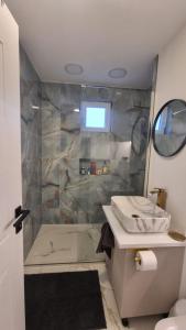 a bathroom with a sink and a shower at Solovan Hill in Sighetu Marmaţiei +36 photos